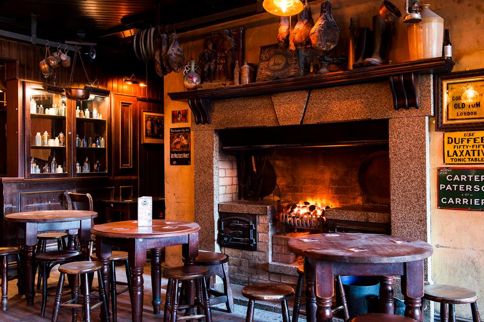 Get cosy by the roaring open fire in a traditional Irish pub
